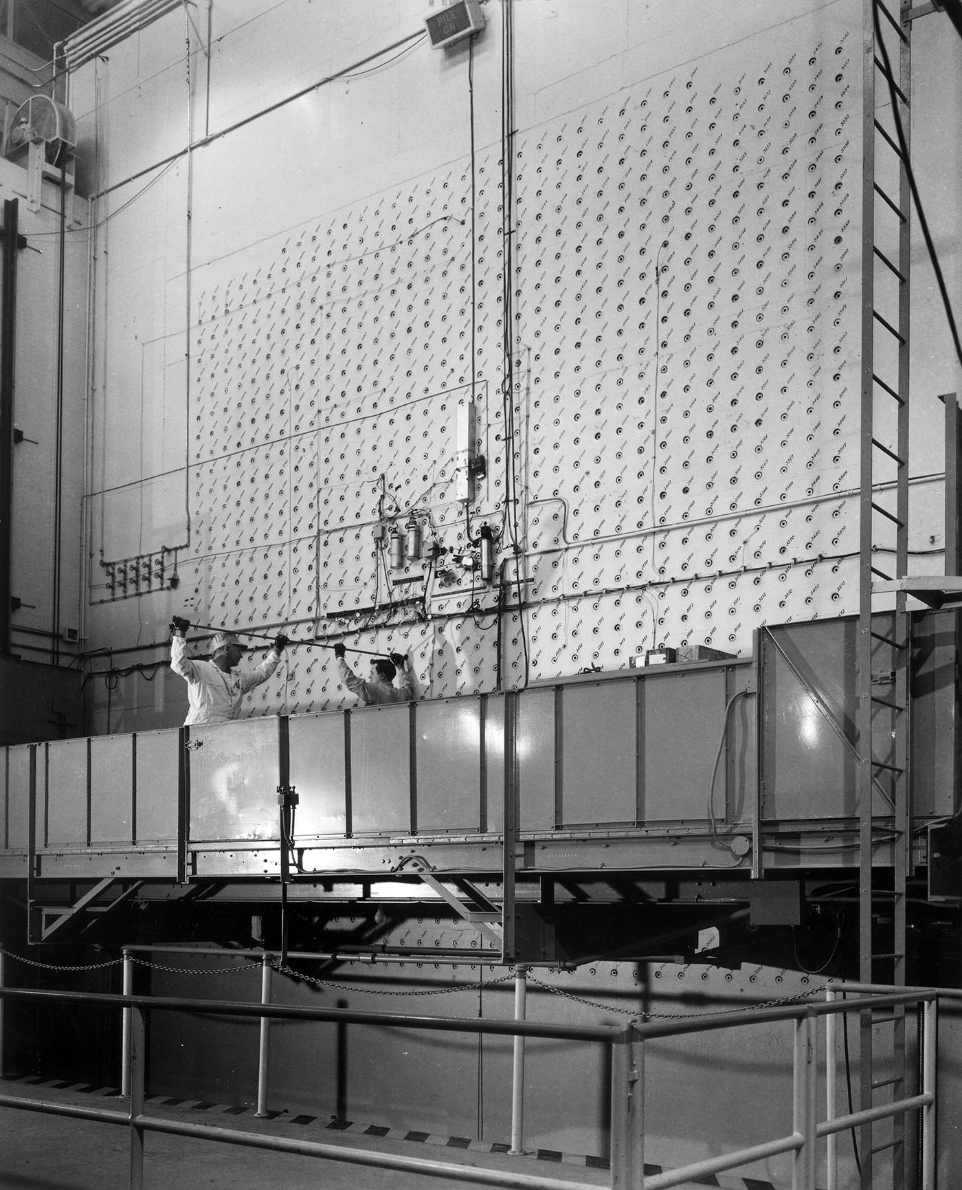 Workers Loading Uranium Slug Into Face of Air-Cooled Pile